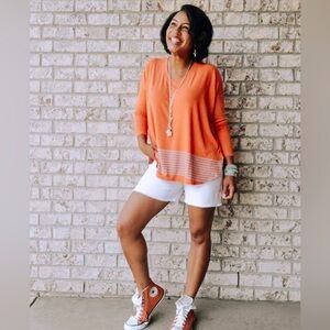 Cabi orange vibrant relaxed simple comfy cozy travel shirt highlow hemline SM